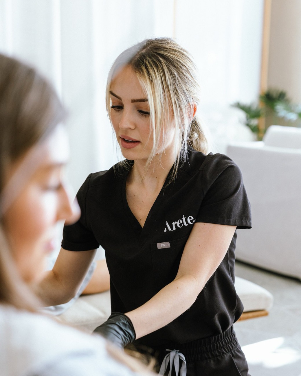 A clinician at the longevity clinic working one-on-one with a client